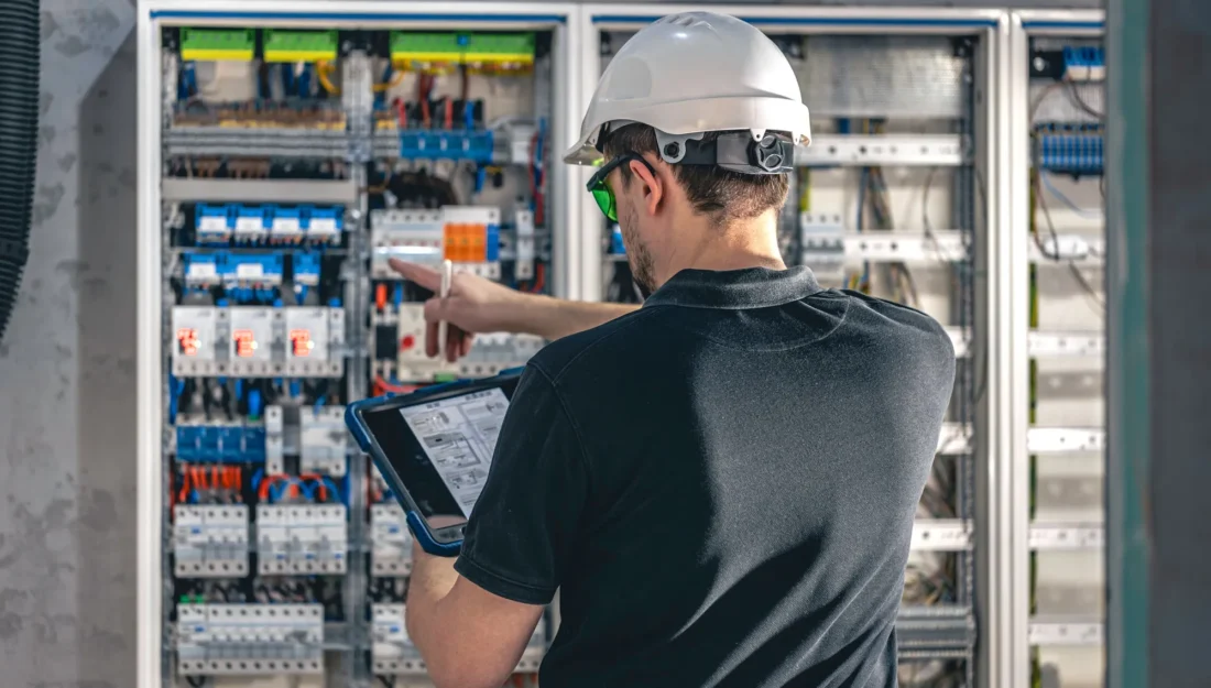 Certified electrician performing electrical installation with safety and precision