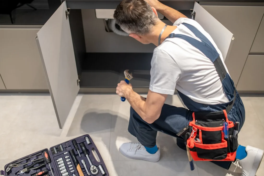 Experienced plumber performing clean and precise plumbing installation with full finishing touches